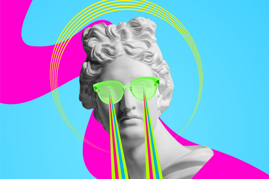 A renaissance style female head statue wearing bright green glasses with various colours shooting out.